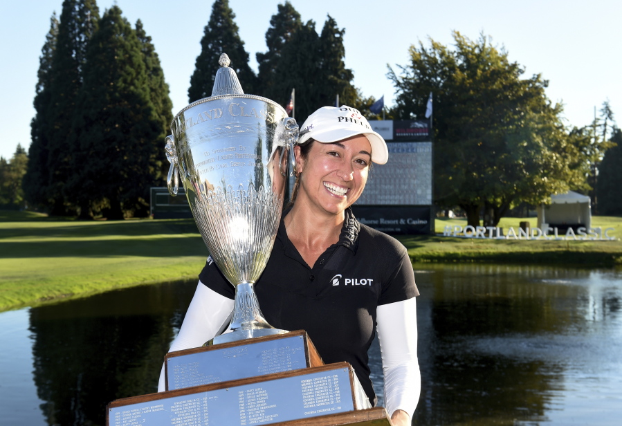 Marina Alex holds the trophy after winning the LPGA Cambia Portland Classic golf tournament in Portland, Ore., Sunday, Sept. 2, 2018.