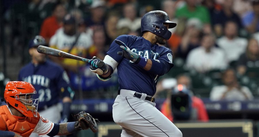 Seattle Mariners’ Robinson Cano, right, hits a RBI single as Houston Astros catcher Martin Maldonado reaches for the pitch during the first inning of a baseball game Wednesday, Sept. 19, 2018, in Houston.(AP Photo/David J.