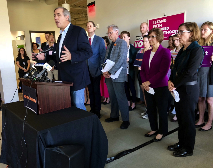 Sen. Jeff Merkley, D-Ore., speaks at a rally and news conference in Portland on Sept. 20.