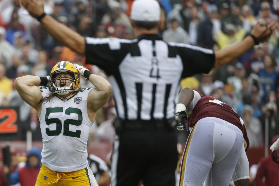 Green Bay Packers linebacker Clay Matthews (52) reacts to his penalty after tackling Washington Redskins quarterback Alex Smith during the second half of an NFL football game, Sunday, Sept. 23, 2018, in Landover, Md.