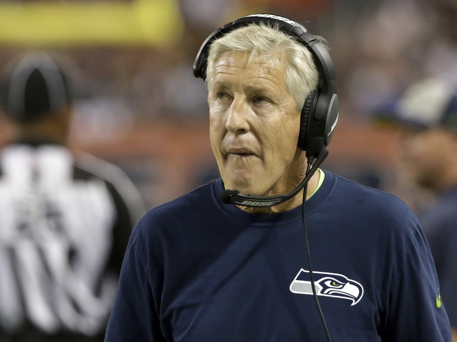 Seattle Seahawks head coach Pete Carroll looks at the scoreboard during the first half of an NFL football game against the Chicago Bears Monday, Sept. 17, 2018, in Chicago.