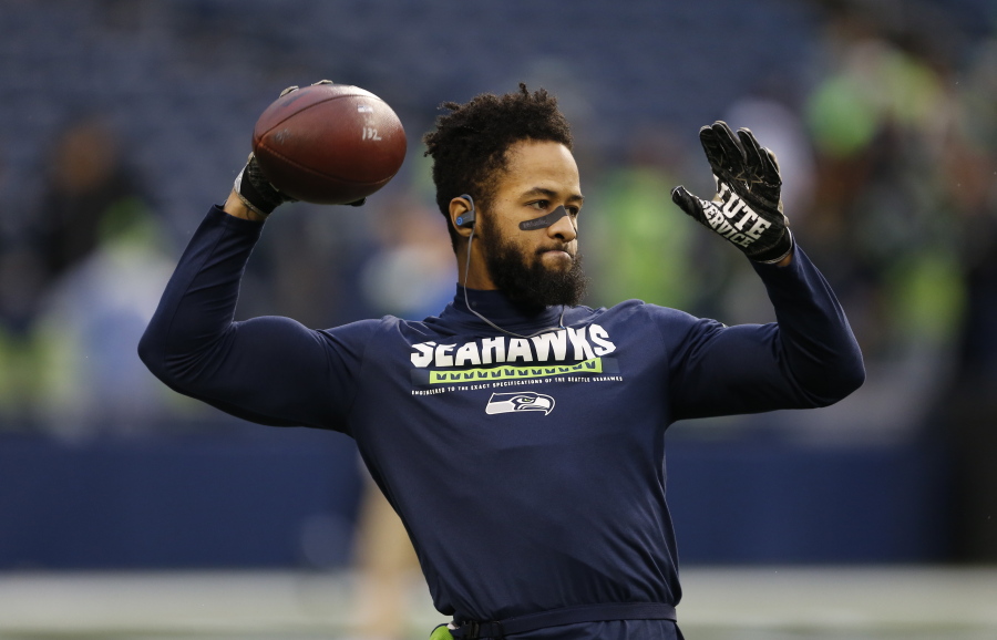 Seahawks safety Earl Thomas ended his holdout without a new deal Wednesday, but it’s unclear if he’ll play Sunday.