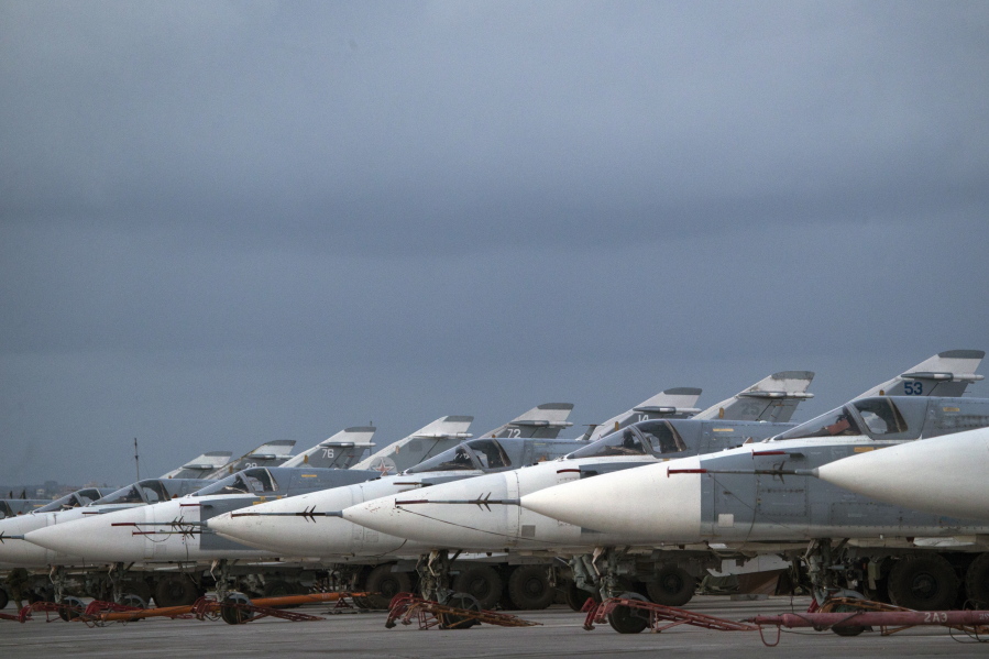 Russian warplanes are parked at Hemeimeem air base in Syria. A Russian reconnaissance aircraft was brought down over the Mediterranean Sea as it was returning to its home base inside Syria, killing all 15 people on board, the Russian defense ministry said Tuesday Sept. 18, 2018.