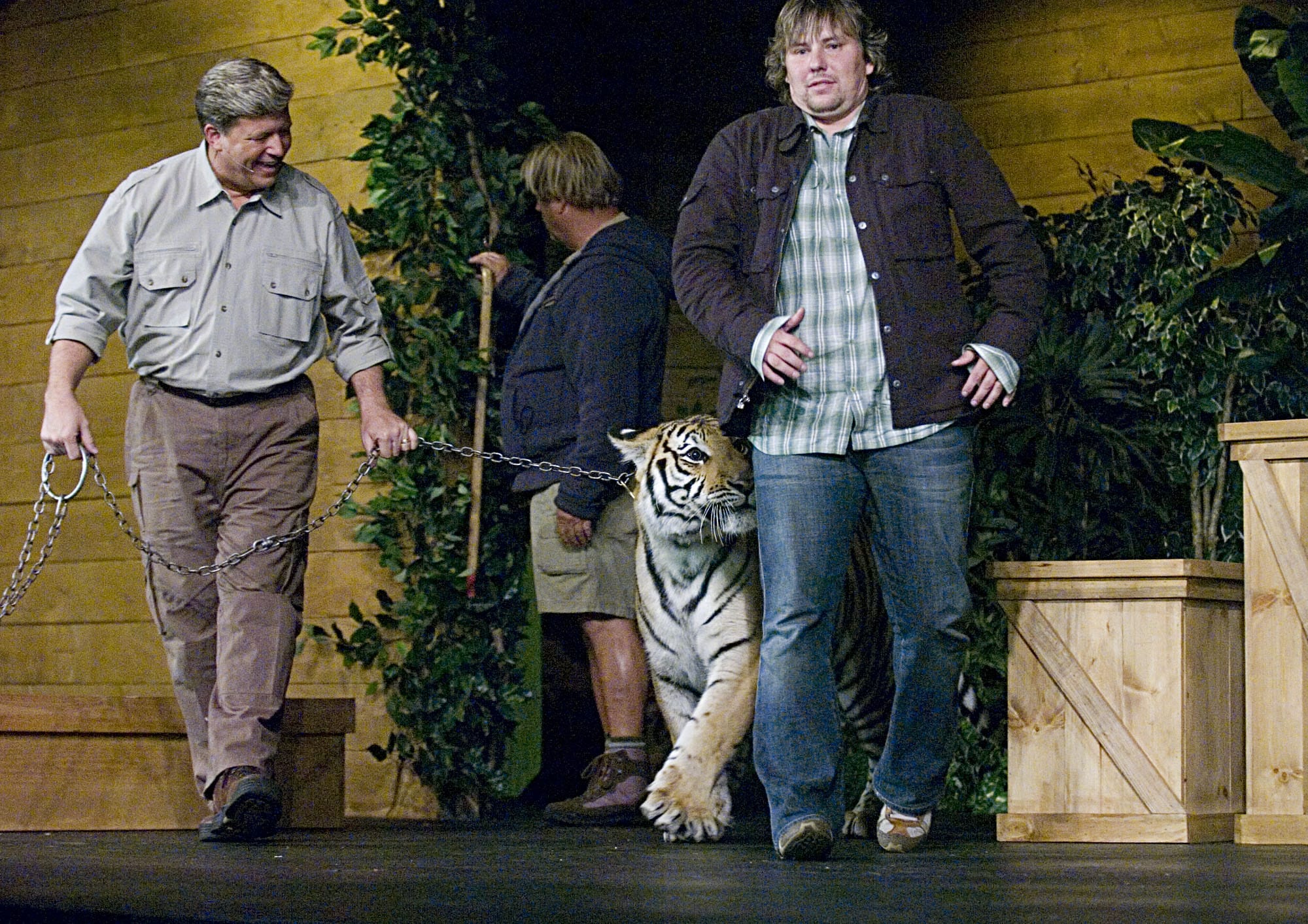 Living Hope Church pastor John Bishop got up close and personal with a tiger named Sundar at a service in 2007,  during the last of the ARK series, "Risk of Moving." From left are Dan Stockdale of Harriman, Tenn., left, and Rick Kelly of San Bernadino, Calif., owner of Amazing Animal Productions.