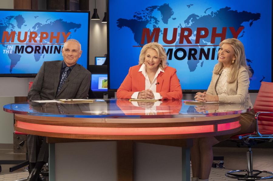 This image released by CBS shows Joe Regalbuto, Candice Bergen and Faith Ford from the comedy series, “Murphy Brown.” Political, social issues and the role of journalism will be central when the sitcom, starring Bergen as a skeptical TV reporter, returned Sept. 27 on CBS. (David Giesbrecht/Warner Bros.