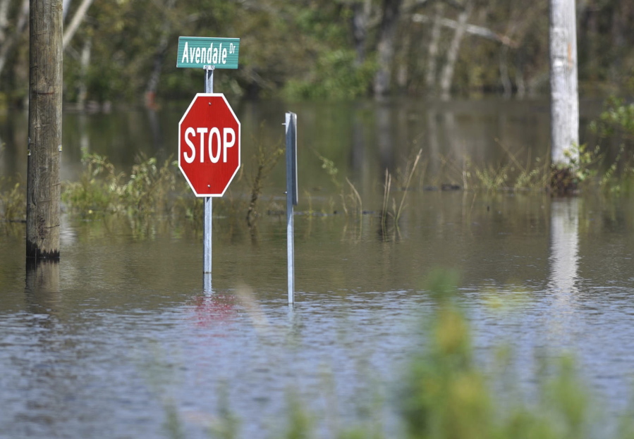 A road is flooded from Hurricane Florence in the Avondale community in Hampstead, N.C., Friday, Sept. 21, 2018.