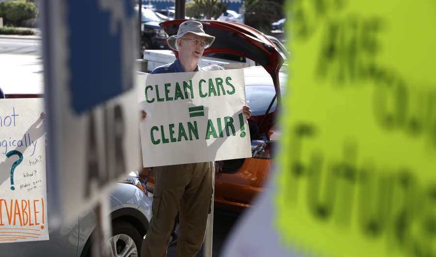 Paul Gipe protests before the first of three public hearings on the Trump administration’s proposal to roll back car-mileage standards in a region with some of the nation’s worst air pollution Monday, Sept. 24, 2018 in Fresno, Calif. The day-long session by the U.S. Environmental Protection Agency and National Highway Traffic Safety Administration is a means to gather public comment concerning the mileage plan, which would freeze U.S. mileage standards at levels mandated by the Obama administration for 2020, instead of letting them rise to 36 miles per gallon by 2025.