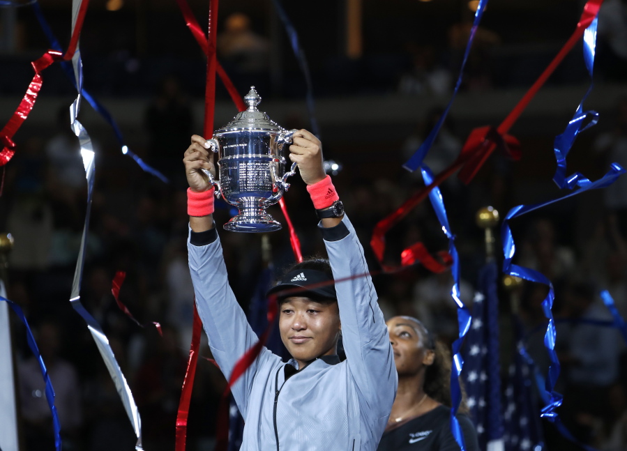 Naomi Osaka, of Japan, holds the trophy after defeating Serena Williams in the women’s final of the U.S. Open tennis tournament, Saturday, Sept. 8, 2018, in New York.