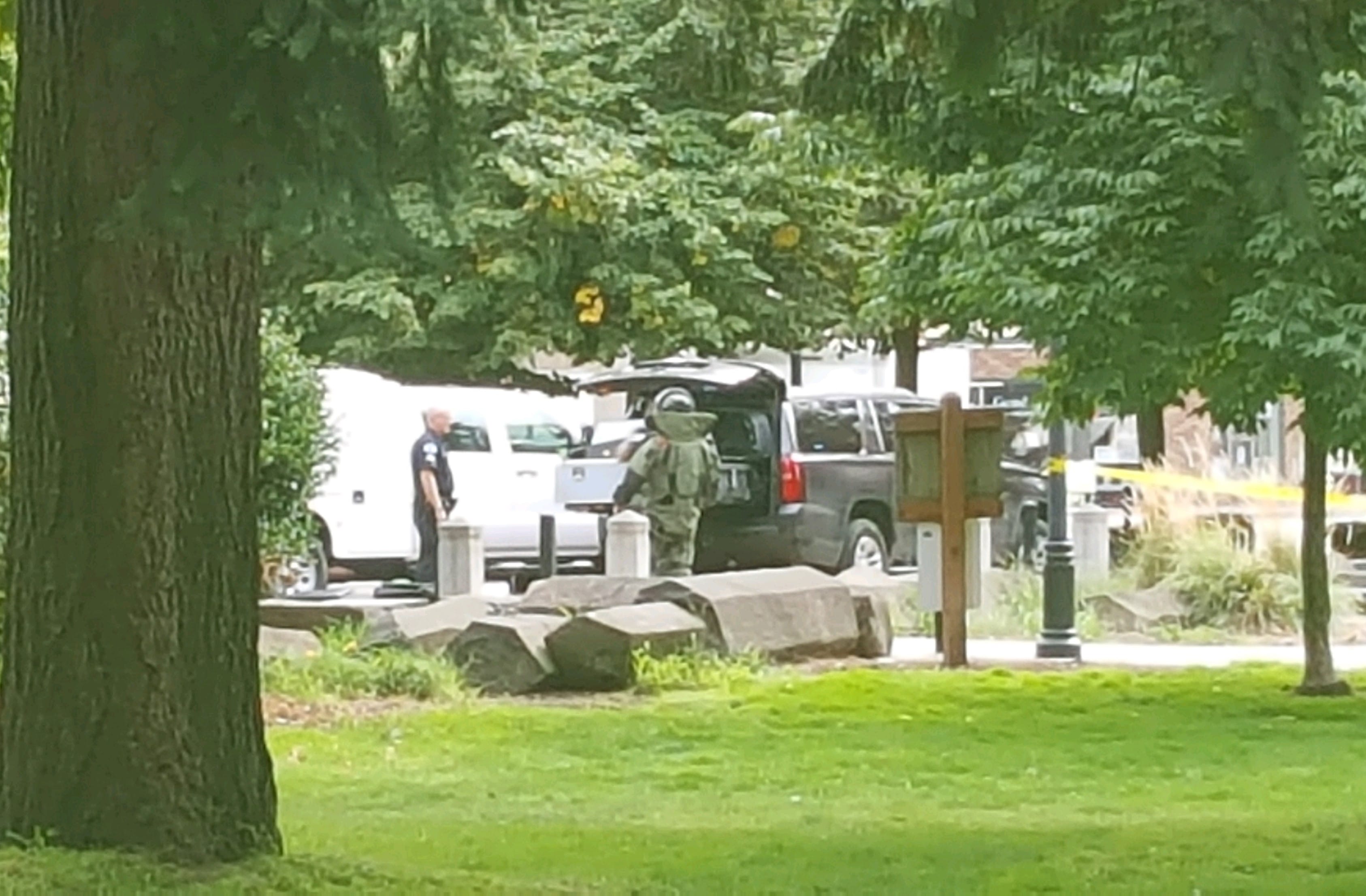 A Vancouver Police Department Bomb Unit officer responds to a call at Esther Short Park on Friday. A Clark County Dispatcher said a man wearing a mask left a bag at the park.