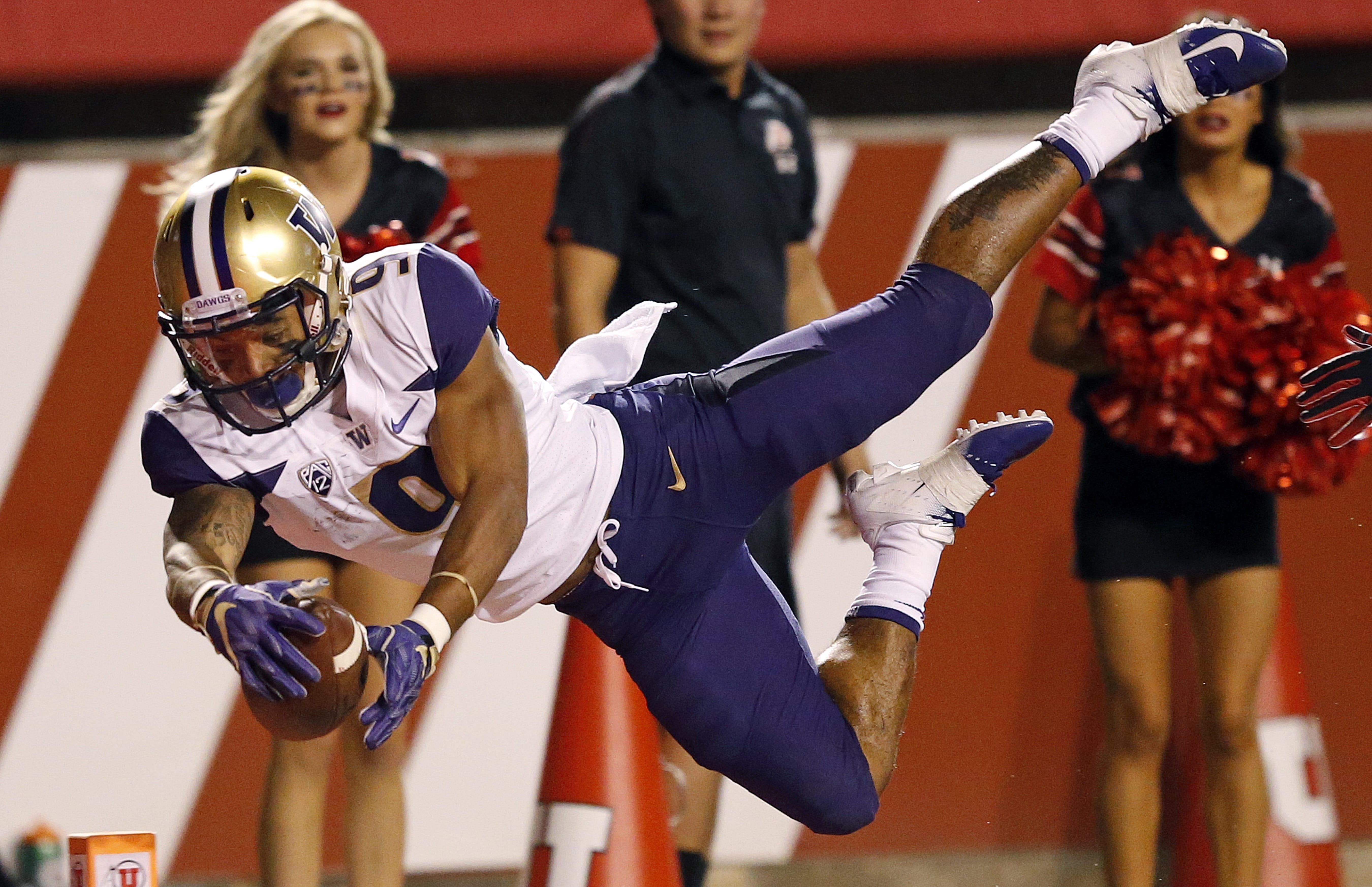 Washington running back Myles Gaskin (9) scores against Utah in the first half during an NCAA college football game Saturday, Sept. 15, 2018, in Salt Lake City.