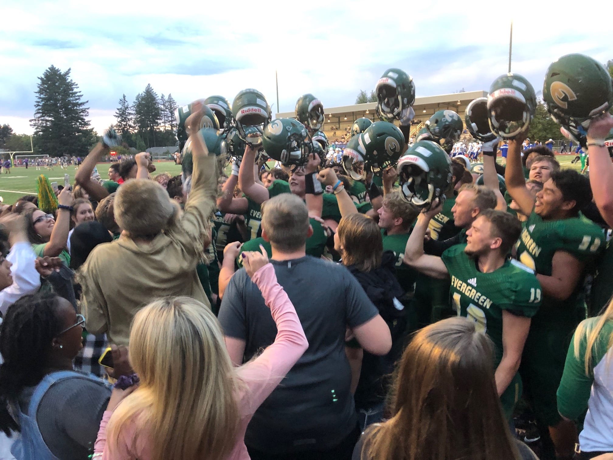 The Evergreen football team celebrates its 41-12 win over Rochester on Friday at McKenzie Stadium.