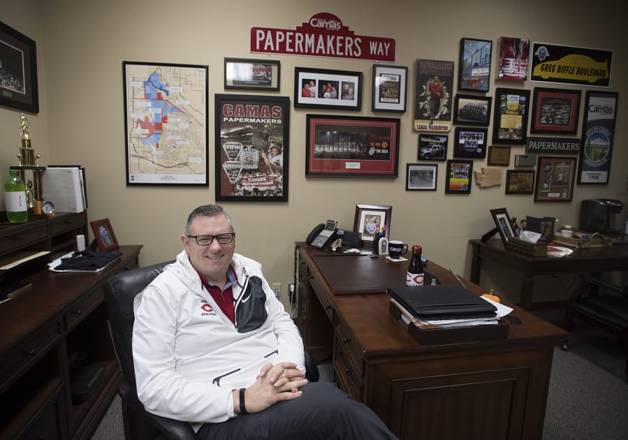 Camas Mayor Scott Higgins sits surrounded by Papermakers paraphernalia in his downtown office in November 2017.