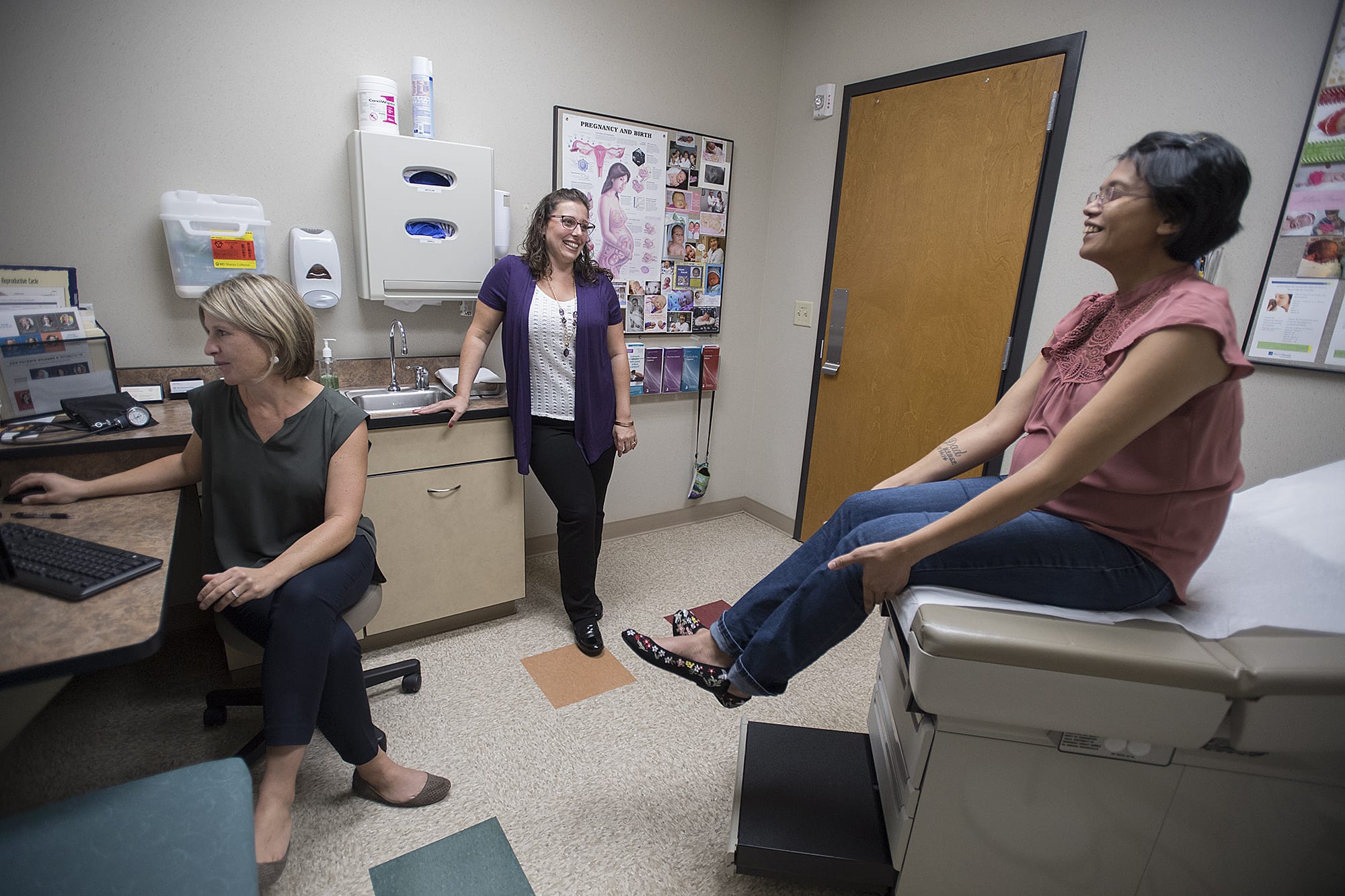 Dr. Anna Eckhardt, from left, joins Adrienne San Nicolas and Naomi Allen during a prenatal checkup for Allen at Vancouver Clinic.