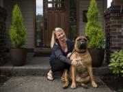 Irene Gielen and her bull mastiff, Alice, are pictured at her home in Vancouver on Sept. 11. Gielen tested positive for the BRCA1 gene in 2016 and since then has had multiple surgeries to reduce her risk of cancer. Gielen had a double mastectomy first and is currently healing from getting her ovaries and fallopian tubes removed in late August.