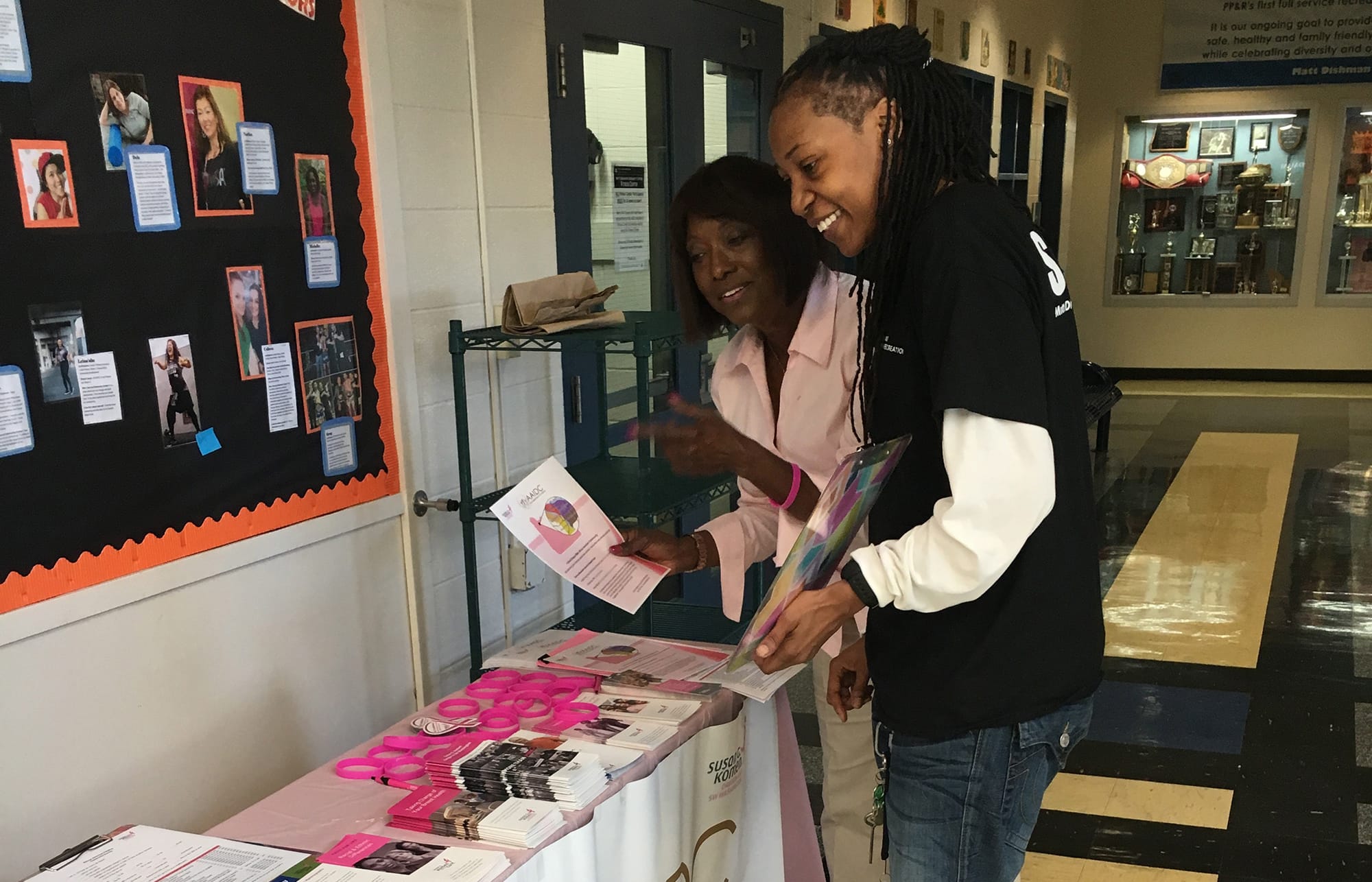 D. Bora Harris interacts with a community member at Matt Dishman Community Center in Portland as part of an initiative to help reduce the breast cancer rate of mortality for African-American women.