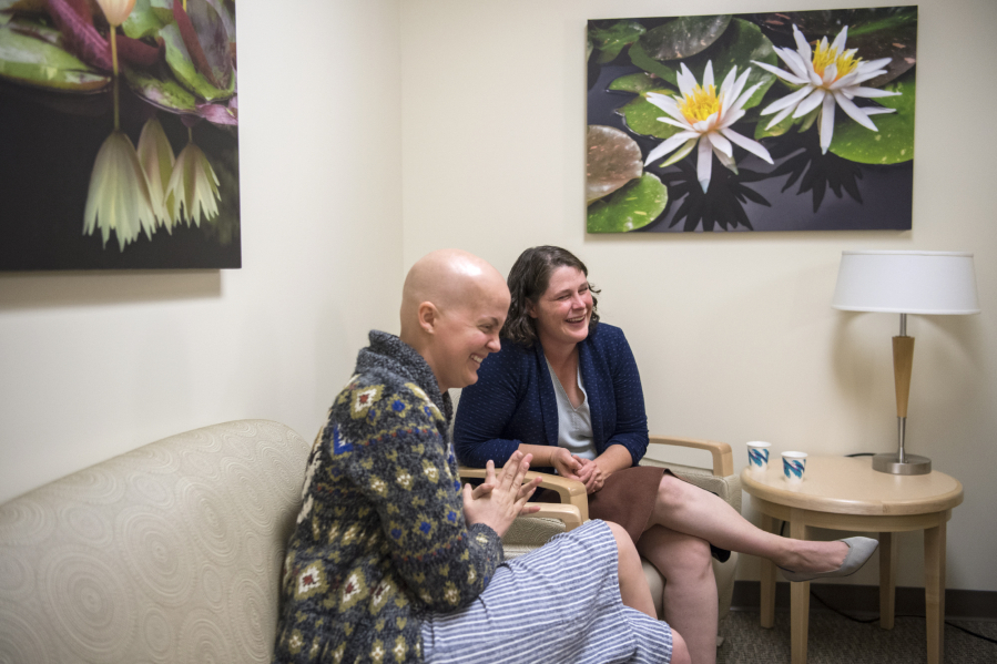 Jana Cox of Vancouver, left, meets with oncology surgeon Dr. Cory Donovan at Legacy Salmon Creek Medical Center. Cox was diagnosed with triple-negative breast cancer in April and just finished eight rounds of chemotherapy. As a survivor of triple-negative breast cancer, Donovan said she sees a lot of herself in Cox.