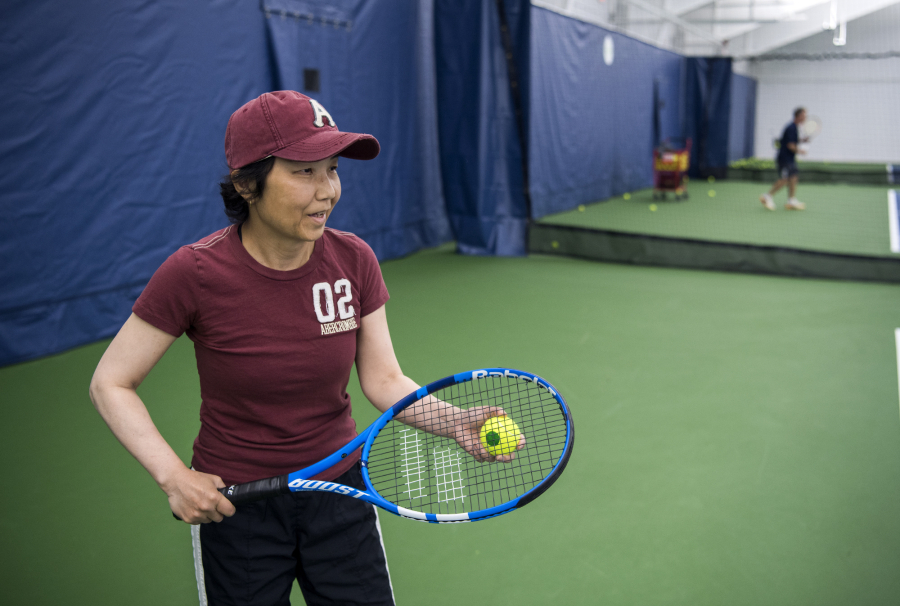 Akemi Noll plays tennis with her husband, Joe, at Vancouver Tennis Center. She was diagnosed with Parkinson’s disease 12 years ago and used a wheelchair for a majority of those years. She recently gained more mobility after a deep brain stimulation surgical treatment. She now plays tennis three times a week and wants to try skiing.