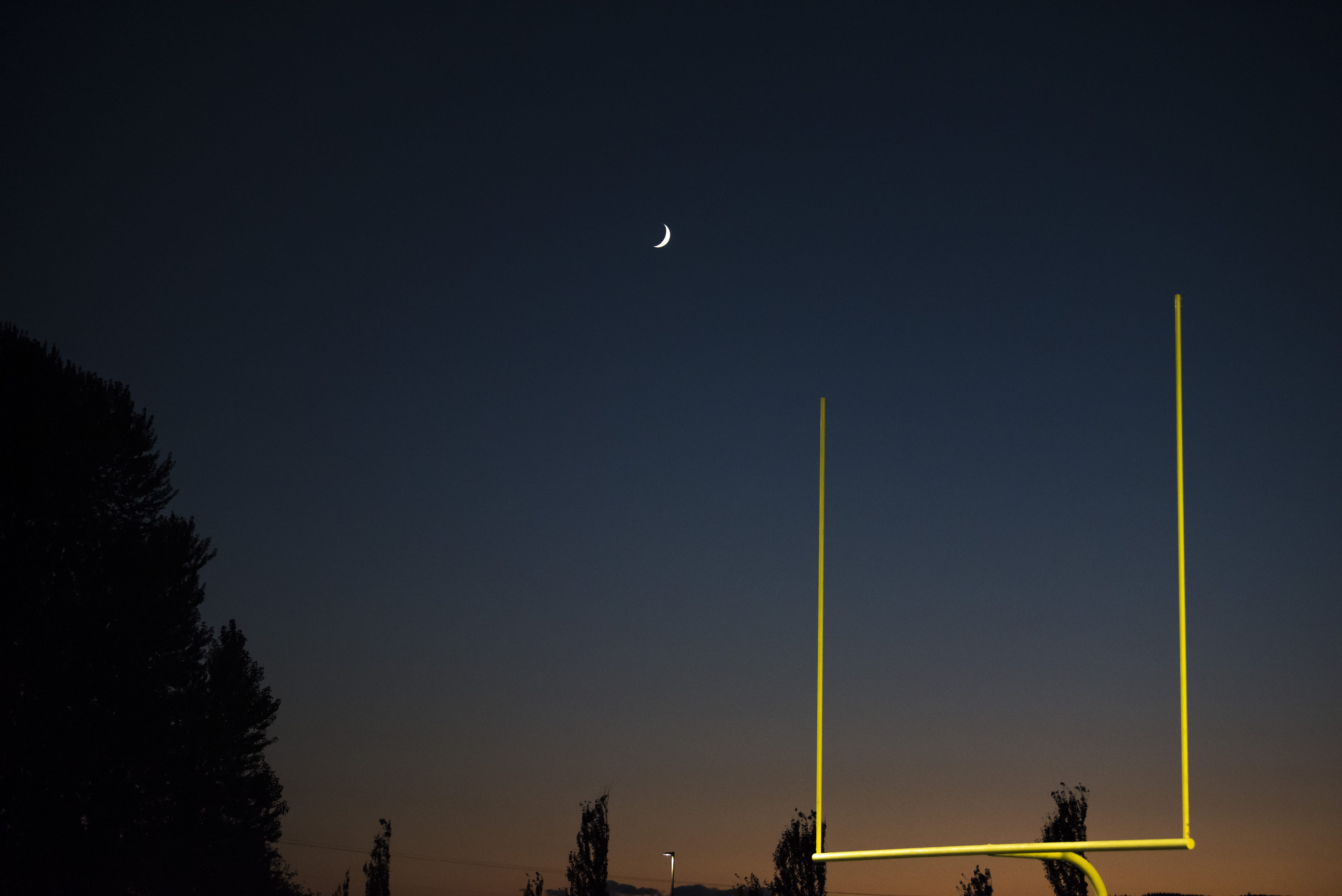 The moon rises over the Woodland, Ridgefield game at Woodland High School on Friday night, Oct. 12, 2018.