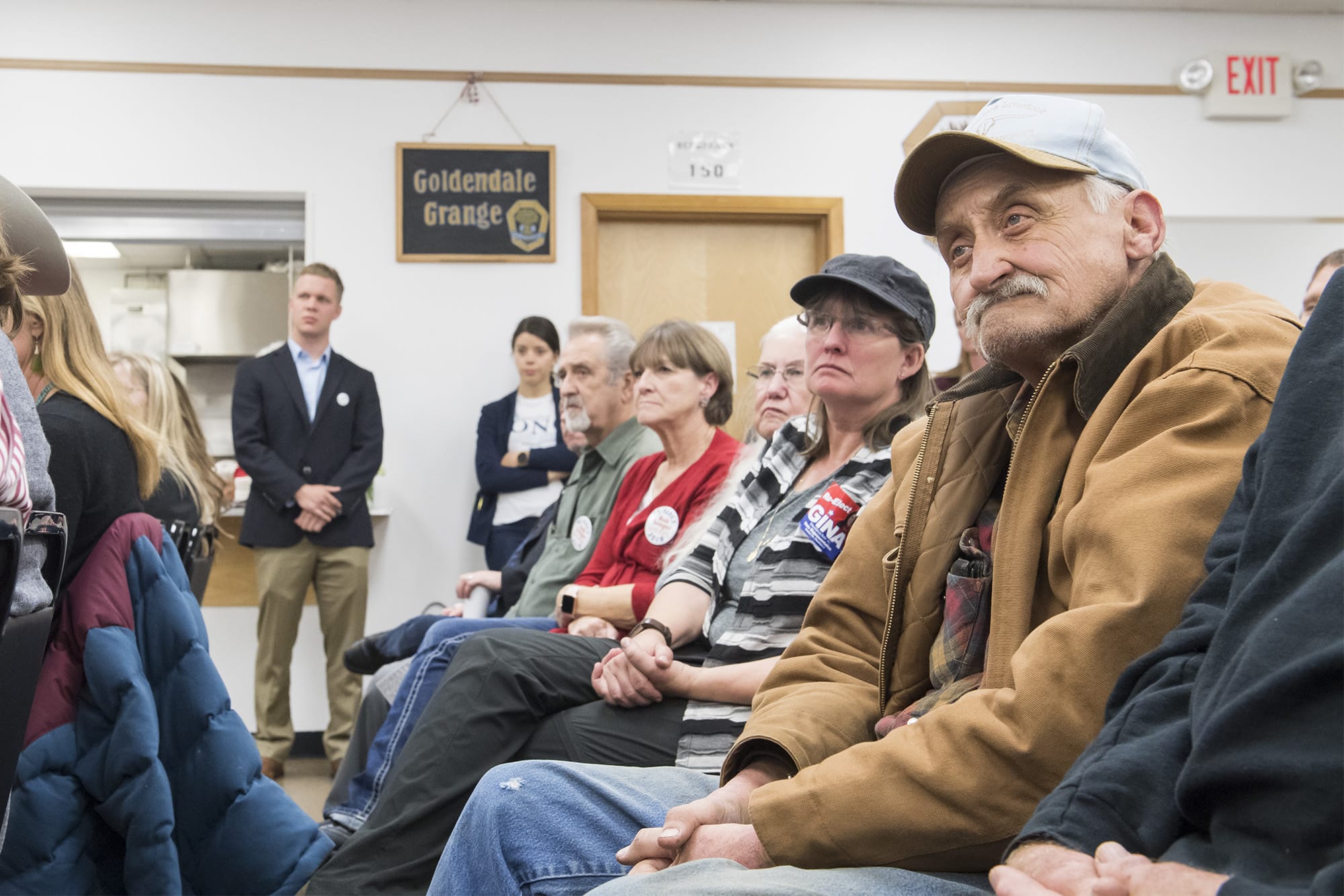 Audience members at the Goldendale Grange Hall candidate forum listen to Democratic candidate Carolyn Long and Incumbent U.S. Rep. Jaime Herrera Beutler, R-Battle Ground, speak on Wednesday night, Oct. 17, 2018.