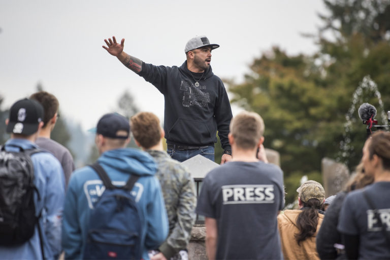 Patriot Prayer's Joey Gibson speaks to a gathered crowd during a protest on the Washington State University Vancouver campus on Tuesday afternoon, Oct. 23, 2018.
