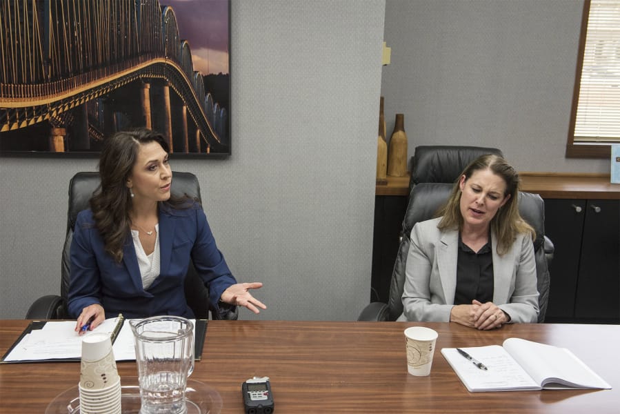 U.S. Rep. Jaime Herrera Beutler, R-Battle Ground, left, and Democratic candidate Carolyn Long speak to The Columbian's Editorial Board in August .