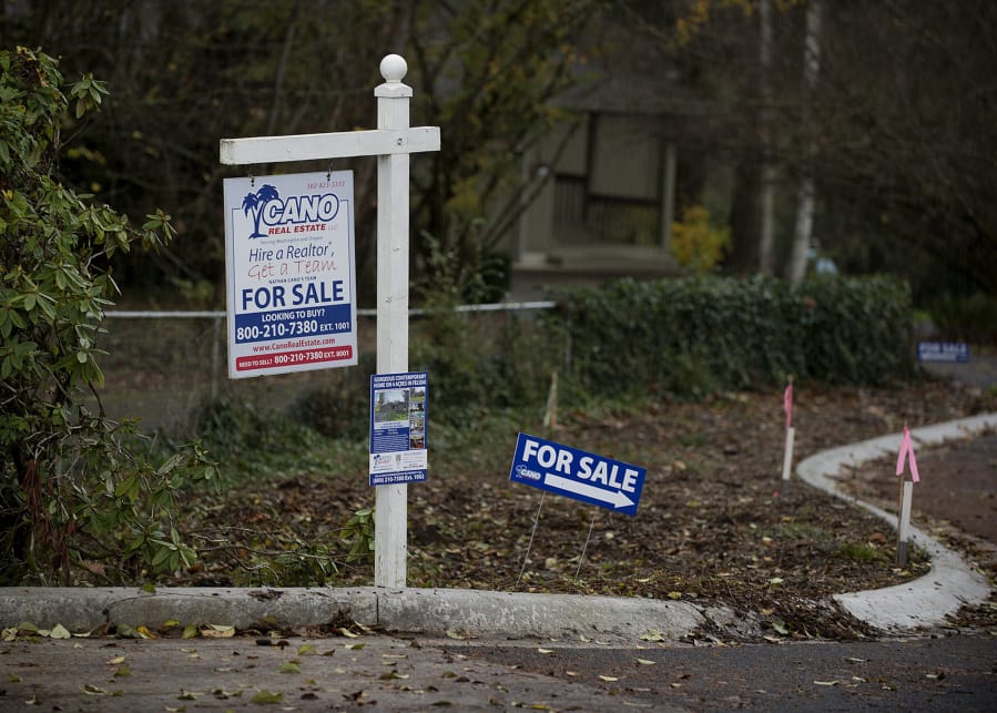 For sale signs are seen along Northwest 108th Circle in Hazel Dell in November 2016.
