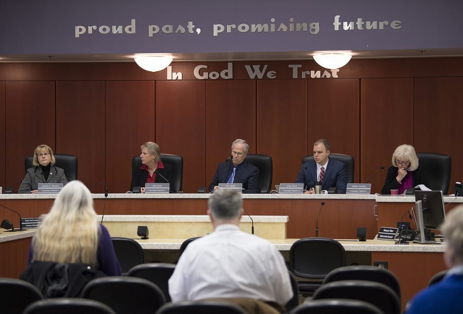 Clark County Council members Jeanne Stewart, from left, Julie Olson, Marc Boldt, John Blom and Eileen Quiring discuss issues during a meeting in Council Chambers in January 2017.