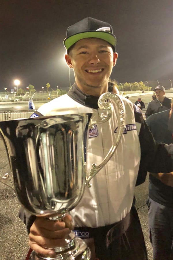 Travis Reeder, a Columbia River High graduate, holds the Formula Drift Pro2 season championship trophy for 2018. He clinched the title last Saturday at Irwindale, Calif.