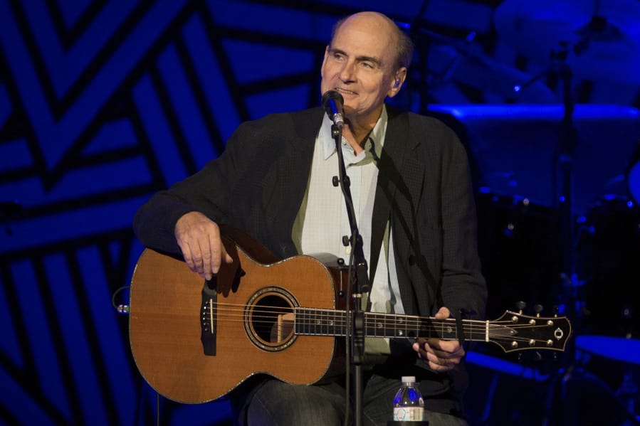 James Taylor performs at Amalie Arena in 2014 in Tampa, Fla. Taylor wants to raise money to help people affected by recent hurricanes.