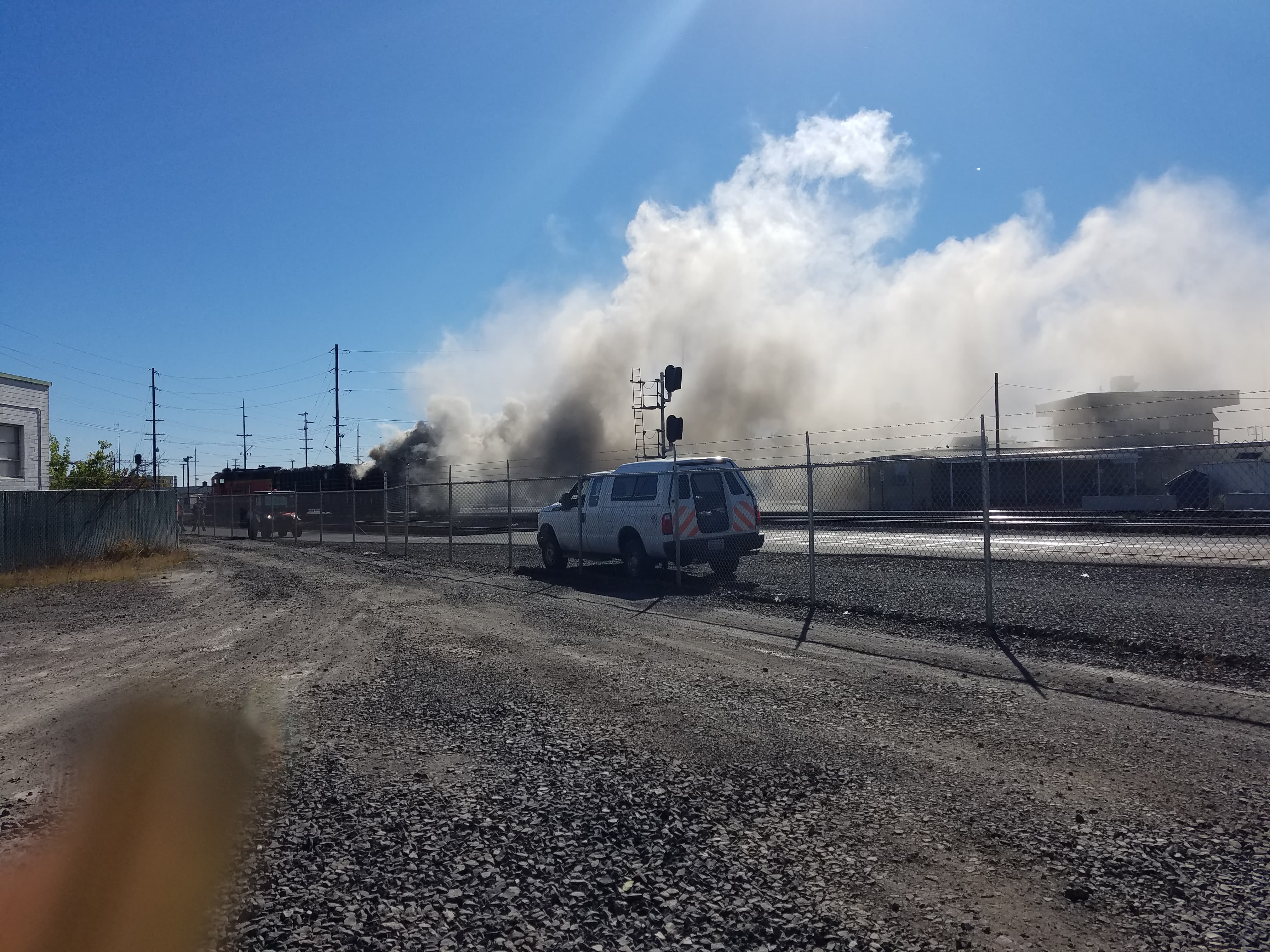 A BNSF rail car burns after catching fire around 12:50 p.m. Sunday.