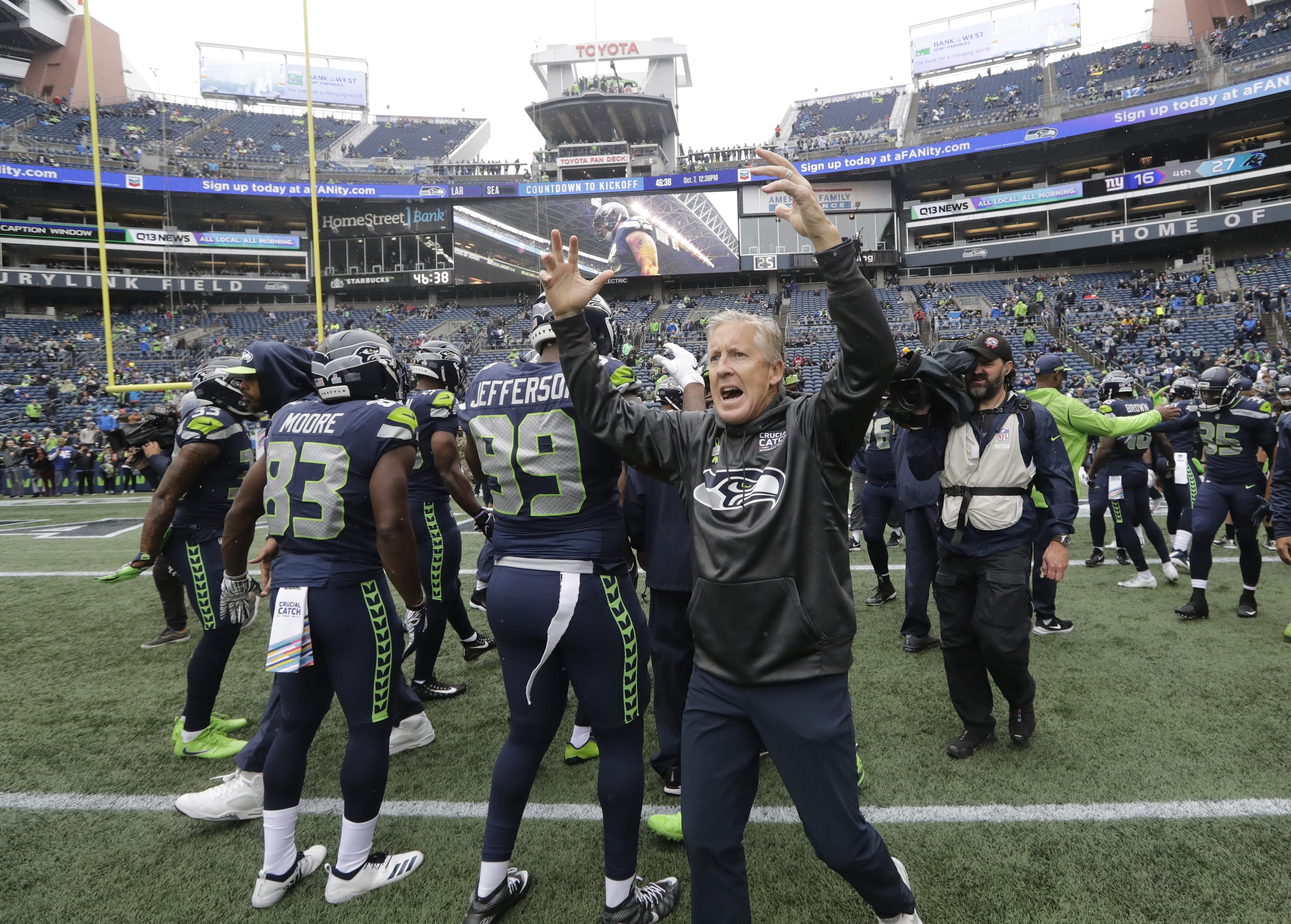 Seattle Seahawks head coach Pete Carroll gestures to his players before playing the Los Angeles Rams, Sunday, Oct. 7, 2018, in Seattle.