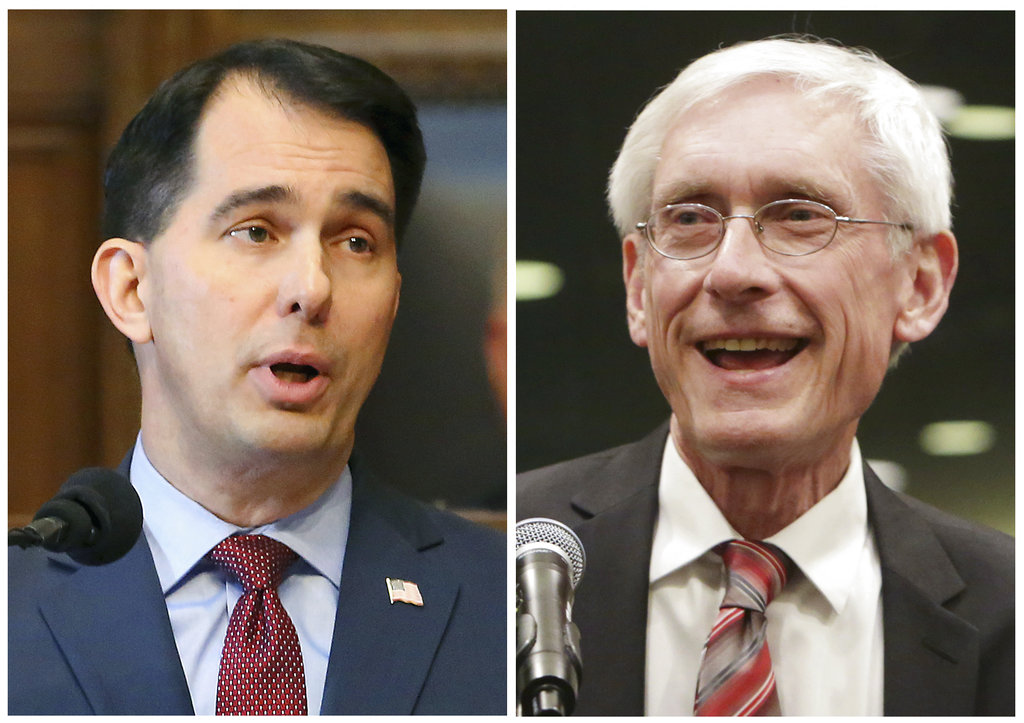FILE - This combination of file photos shows Wisconsin Republican Gov. Scott Walker, left, and his Democratic challenger Tony Evers in the 2018 November general election. Walker, who is seeking a third term, has been working for years to repeal Obama's health care law and signed off on the state attorney general joining the lawsuit against it. But earlier this year, Walker called for a state law that would bar insurers from denying a person health coverage due to a pre-existing condition. Evers, his Democratic rival, launched an ad calling on Walker to drop his support for the lawsuit.