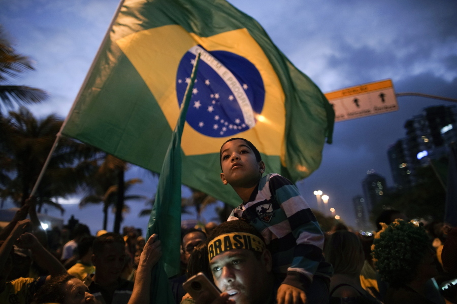Supporters gather outside the residence of presidential candidate Jair Bolsonaro in anticipation of his victory speech, in Rio de Janeiro, Brazil, on Sunday. Brazil’s Supreme Electoral Tribunal declared the far-right congressman the next president of Latin America’s biggest country.
