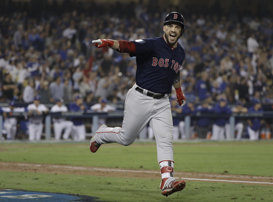 Boston Red Sox’s Steve Pearce celebrates his second home run during the eighth inning in Game 5 of the World Series baseball game against the Los Angeles Dodgers on Sunday, Oct. 28, 2018, in Los Angeles. (AP Photo/David J.