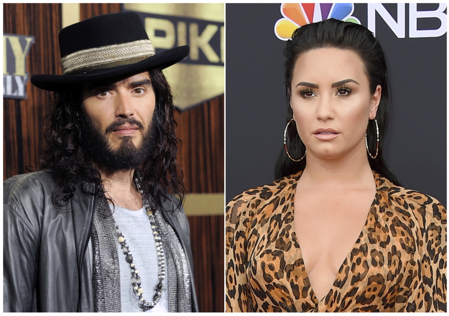 This combination photo shows Russell Brand at “Eddie Murphy: One Night Only,” a celebration of Murphy’s career in Beverly Hills, Calif., on Nov. 3, 2012, left, and singer Demi Lovato at the Billboard Music Awards in Las Vegas on May 20, 2018. Celebrities are now owning the struggle and their roads to recovery. Brand wrote a book about addiction, “Recovery: Freedom from Our Addictions,” calling this the age of addiction an epidemic. Lovato took to Instagram with a health update not long after her recent overdose: “I have always been transparent about my journey with addiction. What I’ve learned is that this illness is not something that disappears or fades with time.