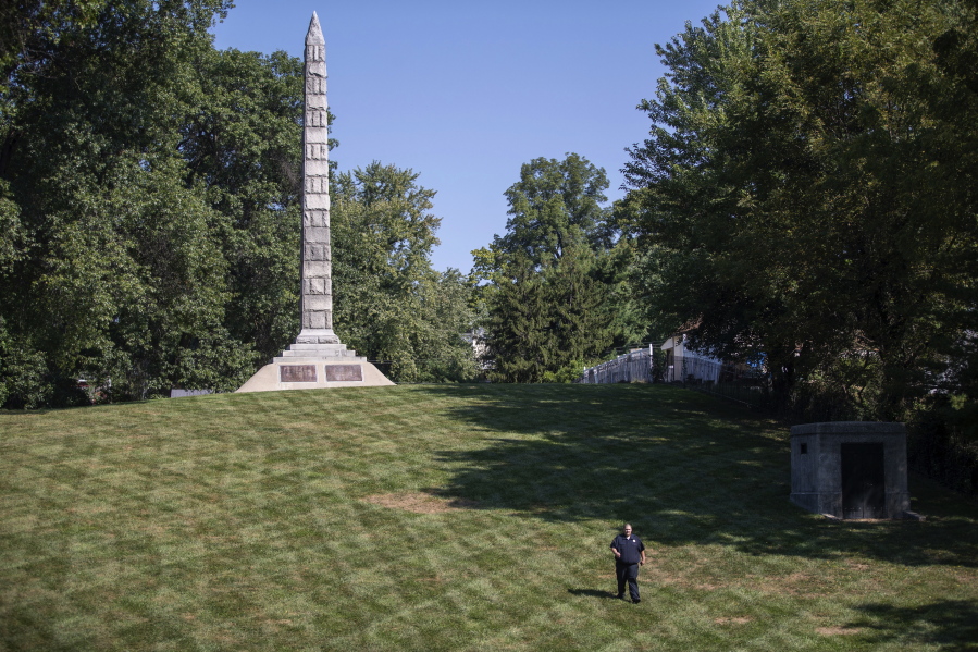 A security guard walks the grounds at North Alton Confederate Cemetery in Alton, Ill. The federal government has hired private security firms to guard several Confederate memorials across the U.S in the aftermath of clashes between white nationalists and counter-protesters last year. Information obtained by The Associated Press shows that nearly $3 million has been spent on contracted security since last summer and another $1.6 million is budgeted for similar protection in fiscal 2019.