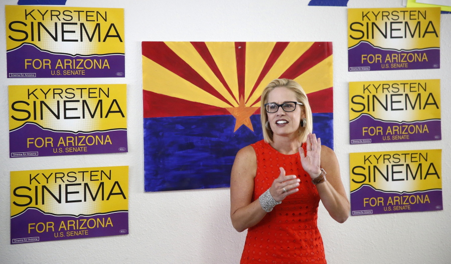 In this Aug. 28, 2018, file photo, Rep. Kyrsten Sinema, D-Ariz., talks to campaign volunteers at a Democratic campaign office in Phoenix. As the November elections near, Democrats are focusing on health care. It's been a constant drumbeat since the GOP launched its effort to repeal the Obama-era health law and is the subject of the greatest share of political ads on television now. It's a top issue in campaigns from Virginia to Nebraska to California, and especially in Arizona, where Democratic Rep. Kyrsten Sinema has made it the foundation of her Senate campaign. (AP Photo/Ross D.