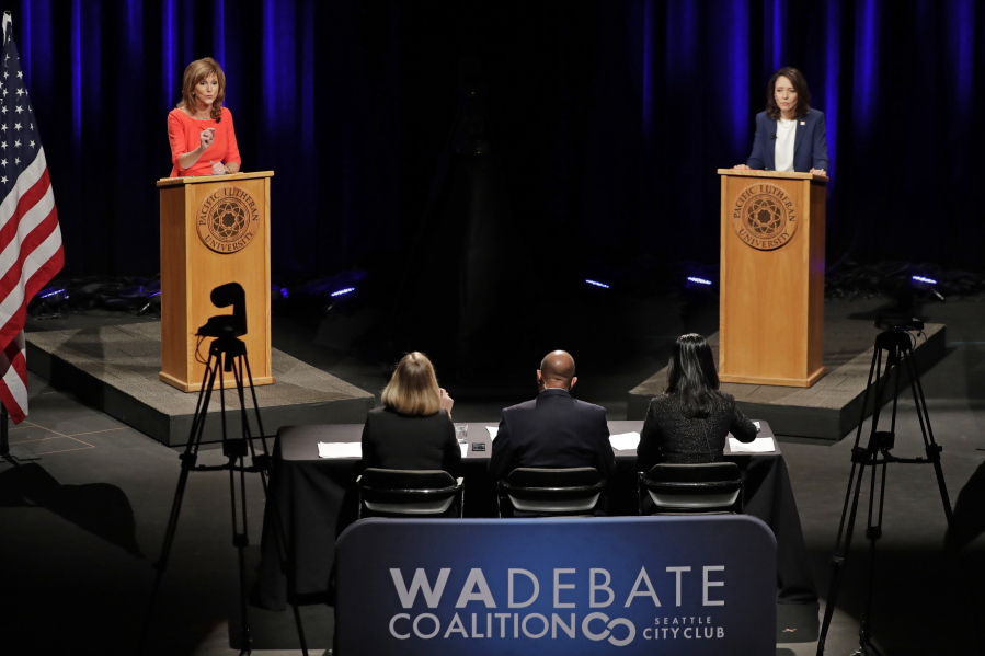 Sen. Maria Cantwell, D-Wash., right, takes part in a debate with her Republican challenger, Susan Hutchison, left, Monday, Oct. 8, 2018, at Pacific Lutheran University in Tacoma, Wash. (AP Photo/Ted S.