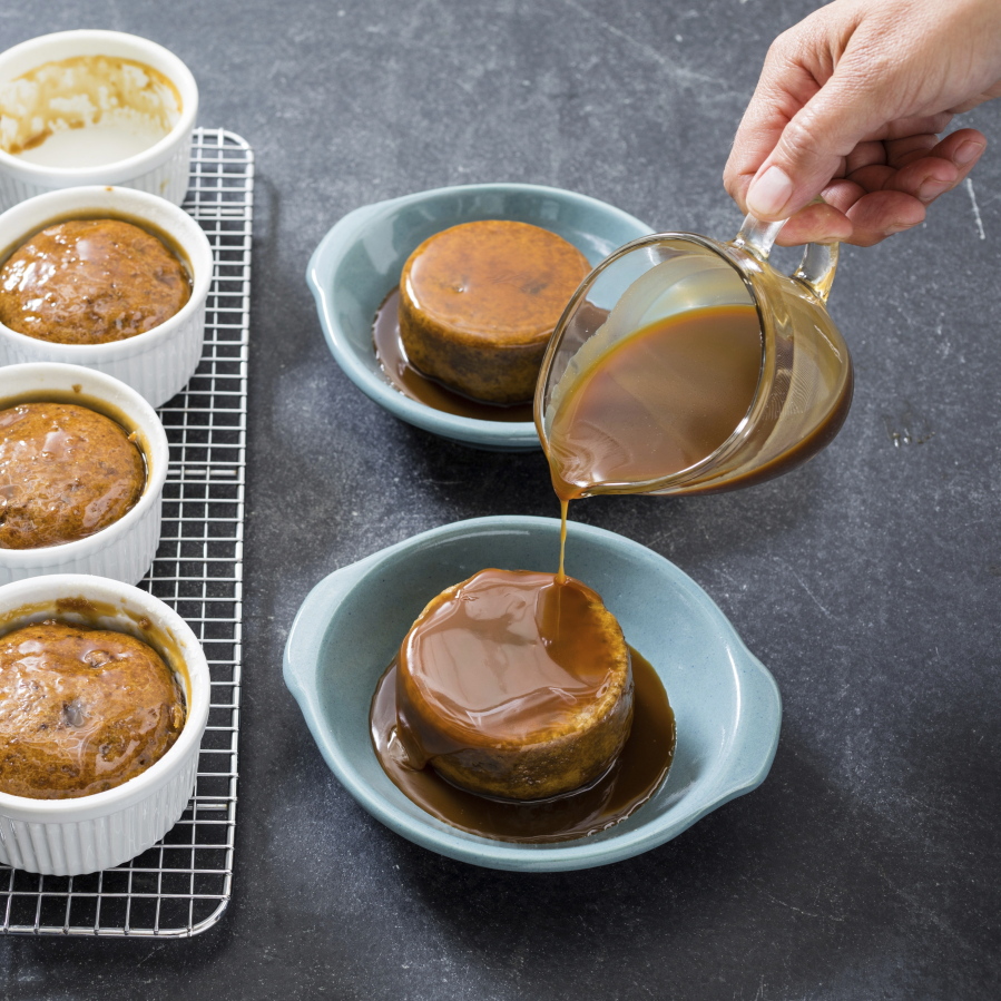 Individual sticky butterscotch pudding cakes. This recipe appears in the cookbook “Just Add Sauce.” (Daniel J.