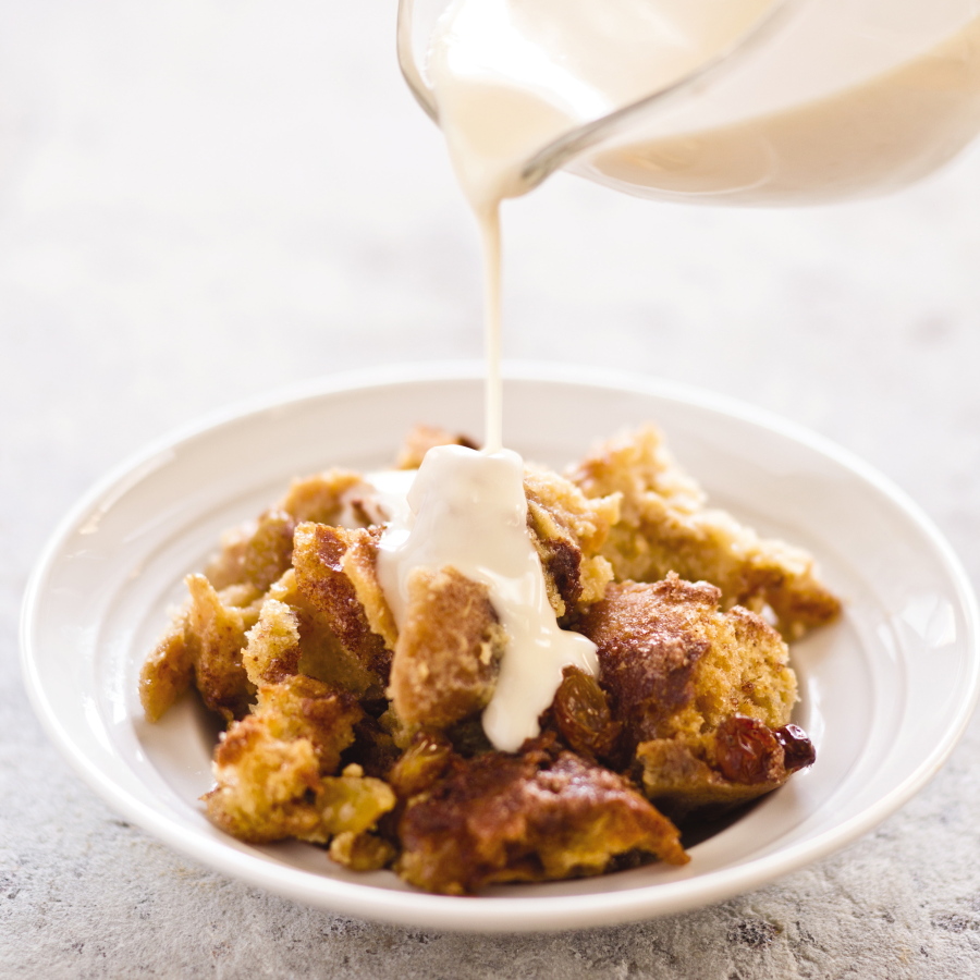 New Orleans bourbon bread pudding with bourbon sauce in Brookline, Mass. This recipe appears in the cookbook “Cooking At Home With Bridget and Julia.” (Daniel J.