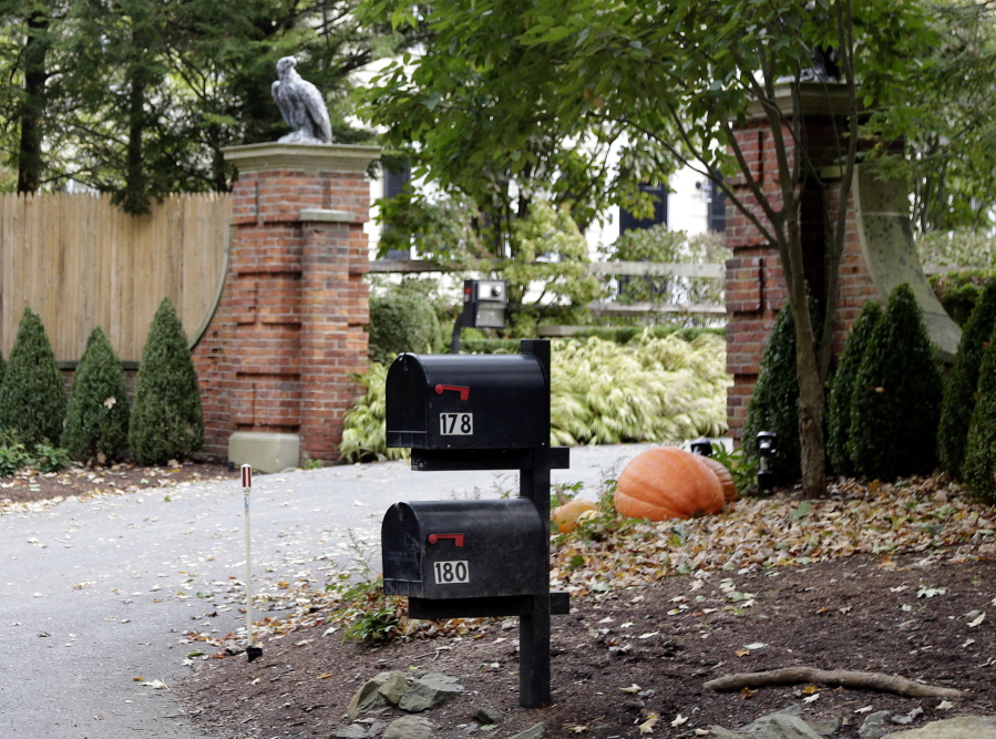 Mailboxes stand outside the entrance to a house owned by philanthropist George Soros in Katonah, N.Y., a suburb of New York City on Tuesday. A device found outside the compound “had the components” of a bomb, including explosive powder, a law enforcement official said Tuesday.