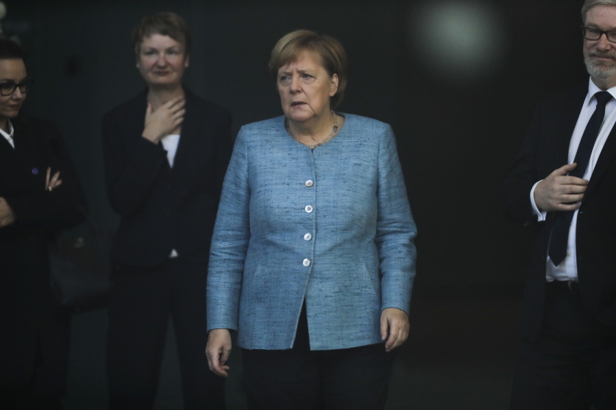 German Chancellor Angela Merkel arrives at the foyer of the chancellery to welcome the Prime Minister of Ethiopia, Abiy Ahmed Ali, for a meeting at the chancellery in Berlin, Germany, on Tuesday.