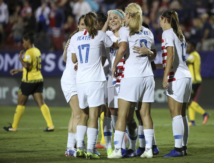 Teammates celebrate after United States midfielder Julie Ertz (facing camera) scored a goal during the first half of a CONCACAF women’s World Cup qualifying tournament soccer match in Frisco, Texas, Sunday, Oct. 14, 2018.