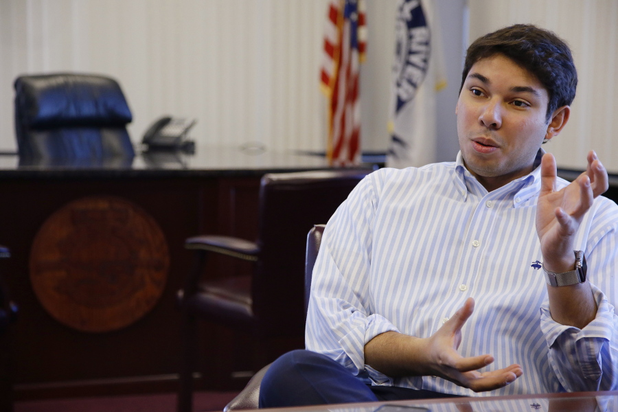 Newly elected Fall River Mayor Jasiel Correia talks in his city hall office in Fall River, Mass. A Massachusetts mayor was arrested Thursday, Oct. 11, 2018, and charged with defrauding investors in a company he formed out of more than $230,000 and using the funds to enhance his political career and pay for a lavish lifestyle, federal prosecutors said.