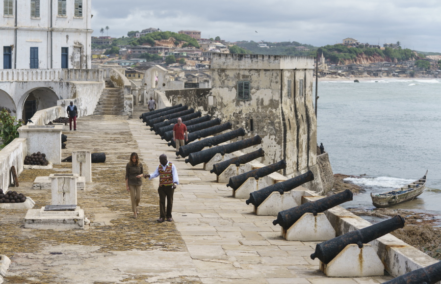 First lady Melania Trump tours Cape Coast Castle with Cape Coast Castle museum educator Kwesi Essel-Blankson in Cape Coast, Ghana, on Wednesday. The first lady is visiting Africa on her first solo international trip.