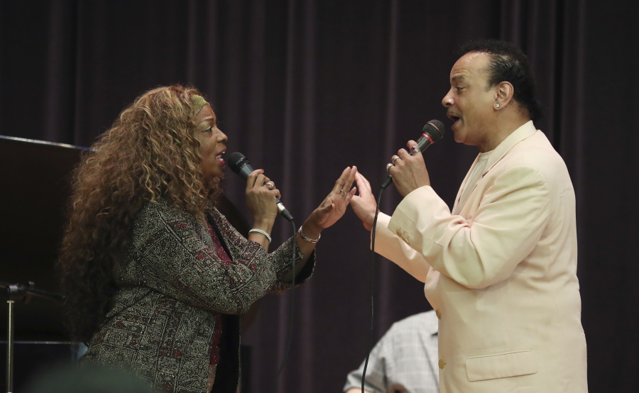 In this July 31, 2018, photo, singers Mark Scott of The Miracles and Joan Belgrave, left, perform in Detroit. The music of Motown still beguiles audiences around the globe. But the music of Stevie, Martha, the Supremes and Temptations doesn’t get heard regularly and reliably in Detroit, the city of its birth. Belgrave is among those out to change that: She’s brought it to many venues and hopes to secure a place “dedicated to the genre.” She said what exists isn’t enough for a city with such a sonic lineage and legacy.