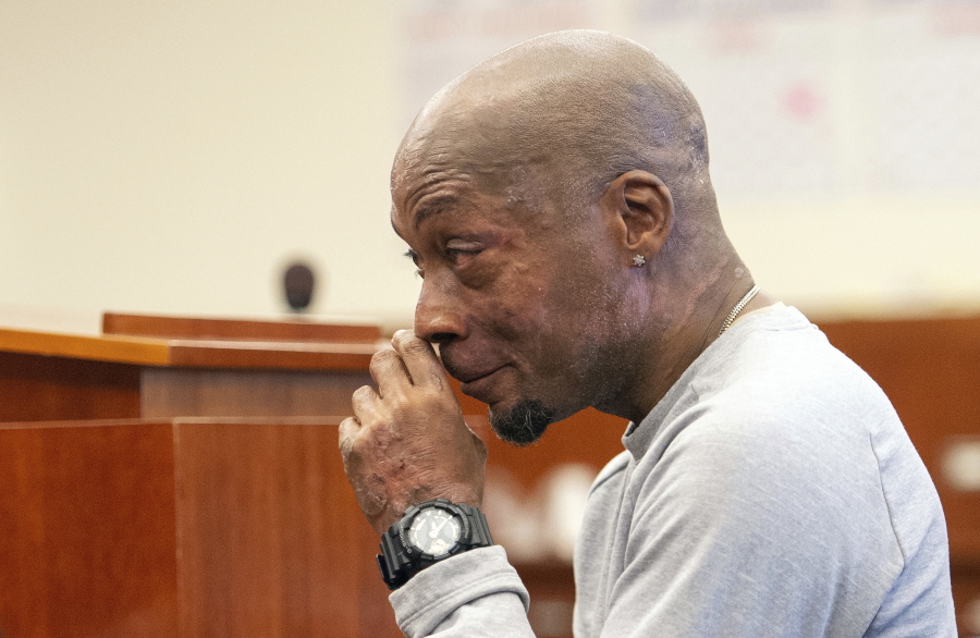 FILE - In this Aug. 10, 2018, file photo, plaintiff DeWayne Johnson reacts after hearing the verdict in his case against Monsanto at the Superior Court in San Francisco. A Northern California judge has upheld a jury’s verdict finding Monsanto’s weed killer caused the groundskeeper’s cancer, but slashed his $287 million award to $78 million. San Francisco Superior Court Judge Suzanne Bolanos ruled Monday, Oct. 22.