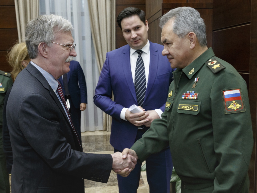 U.S. National Security Adviser John Bolton, left, and Russian Defense Minister Sergei Shoigu shake hands during their meeting in Moscow on Tuesday. U.S. President Donald Trump’s national security adviser Bolton struck a conciliatory note Tuesday in talks in Moscow, just days after Trump vowed to pull out of a key arms control treaty with Russia.