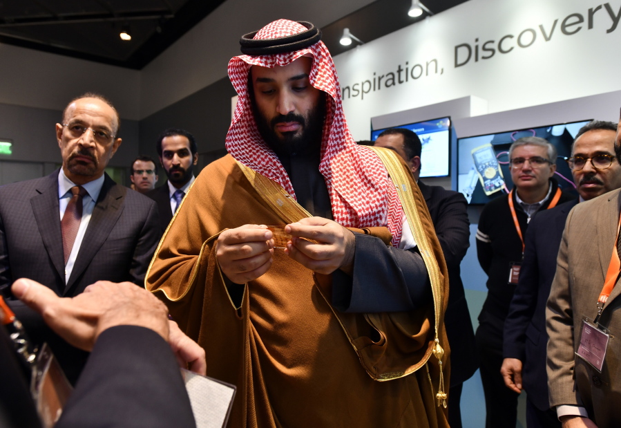 Saudi Arabia Crown Prince Mohammed bin Salman tours an innovation gallery of Saudi Arabian technology, including an exhibit by King Abdullah University of Science and Technology, during a visit to Massachusetts Institute of Technology in Cambridge, Mass. While some U.S. colleges rethink their ties to Saudi Arabia, many more have shown no signs of backing away. An Associated Press analysis of federal data finds that 38 schools received at least $359 million from the Saudi government from 2011 through 2017.