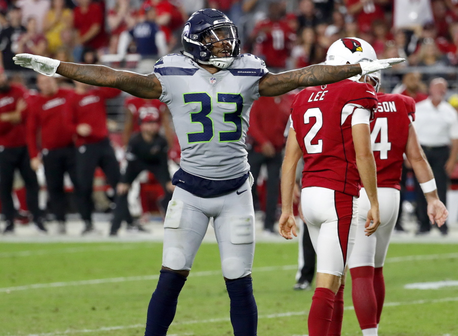 Seattle Seahawks defensive back Tedric Thompson (33) celebrates a missed field goals by Arizona Cardinals kicker Phil Dawson (4) during the second half of an NFL football game, Sunday, Sept. 30, 2018, in Glendale, Ariz. The Seahawks won 20-17.
